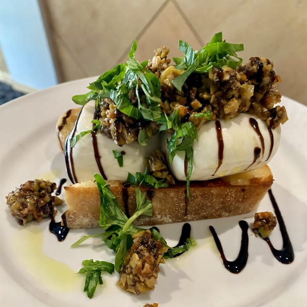Sienna & Hope bistro's burrata toast with balsamic glaze, basil, and olive tapenade.