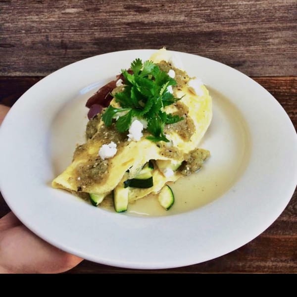 Sienna & Hope bistro's breakfast omelet with green sauce, cilantro, feta, and zucchini.